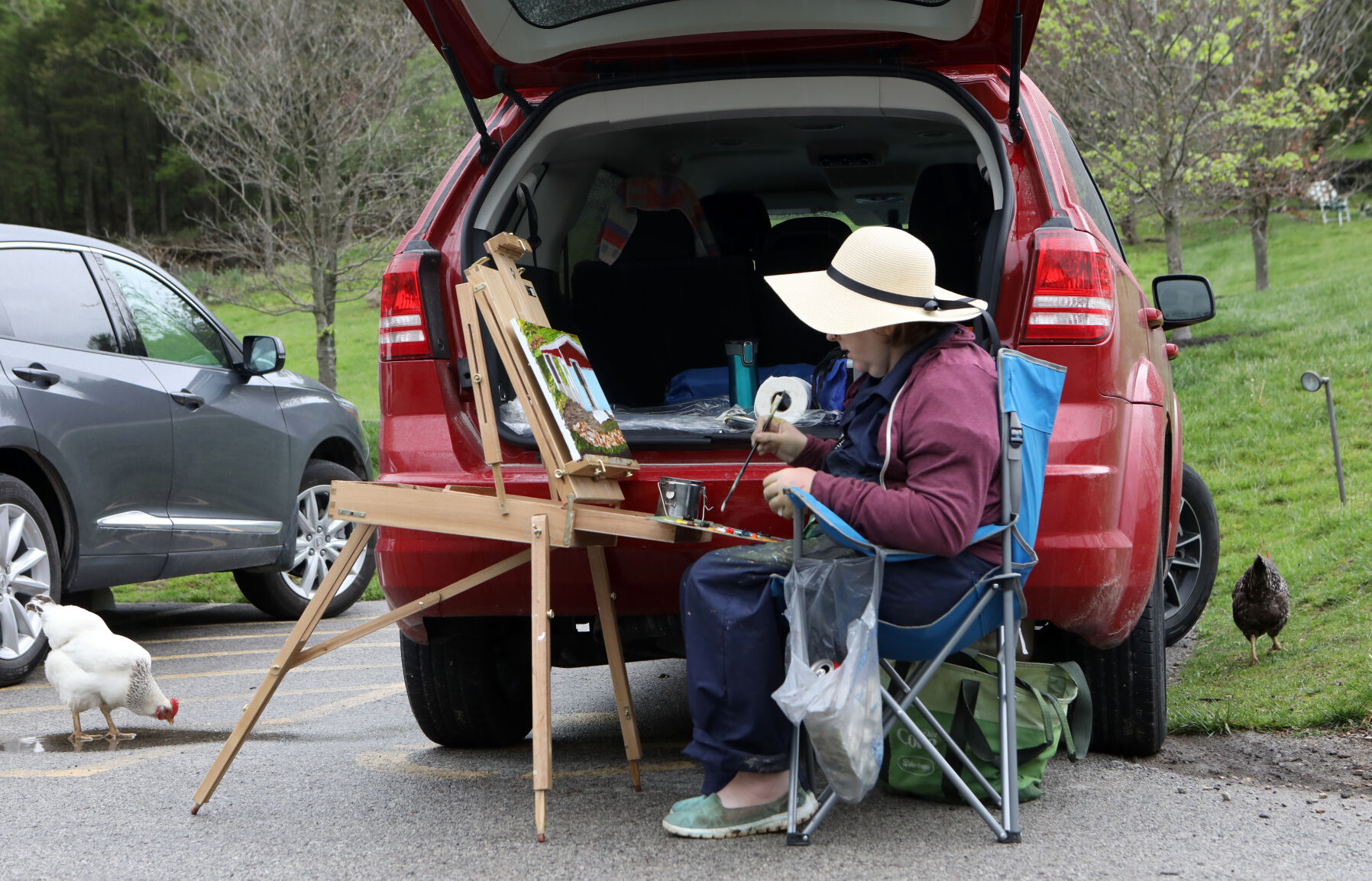 Megan Atchly paints at Sunflower Hill Farms